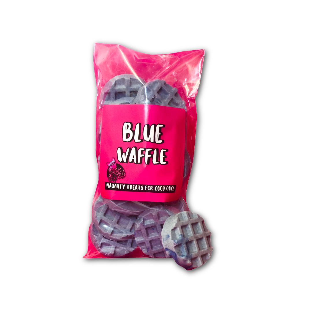 Packet of blue dog chocolates in a waffle shape, with 'Blue Waffle' in white writing on a pink sticker. One blue waffle is outside of the packet. On a white background.