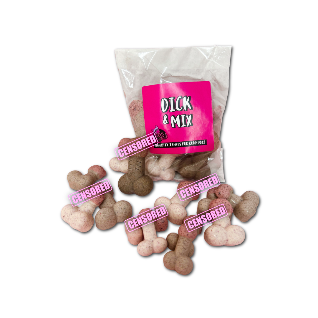 Bag of 'Dick & Mix' dog treats with a pink label. Chocolate pink and brown peen treats are also out of the packet. On a white background.