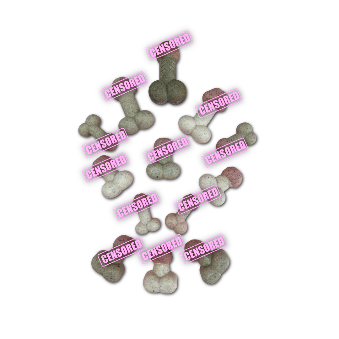 Dog chocolates shaped like peens in different sizes and colours- pink and brown, on a white background.