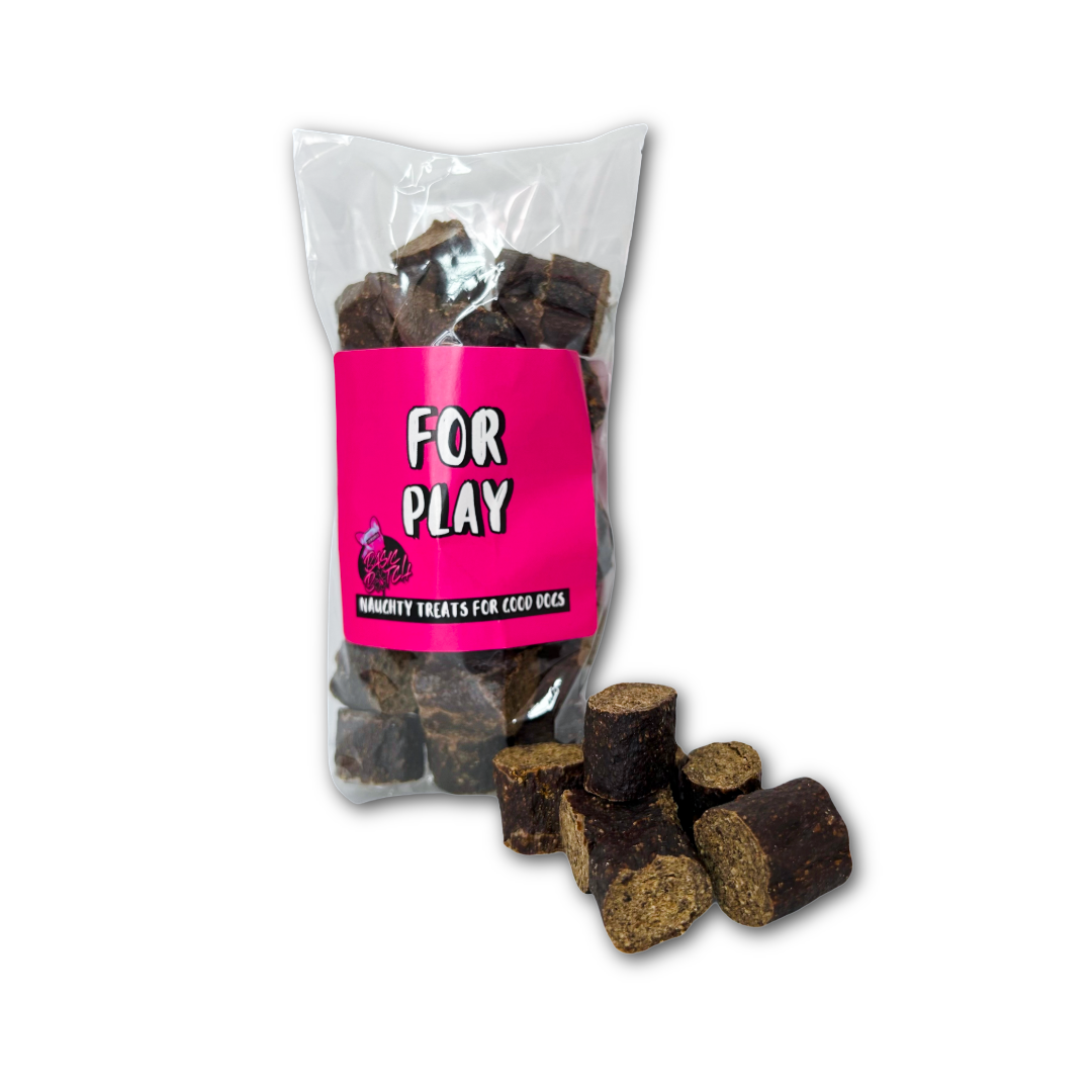 Bag of small brown chopped sausage dog treats labeled 'For Play' on a white background.