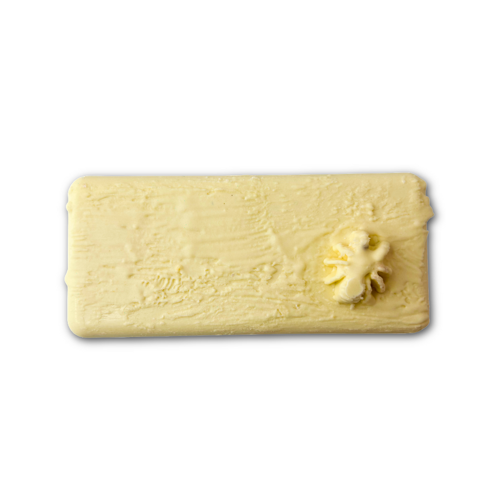 White chocolate bar with a white spider in the bottom left corner- white chocolate paintbrush strokes over the top, on a white background.