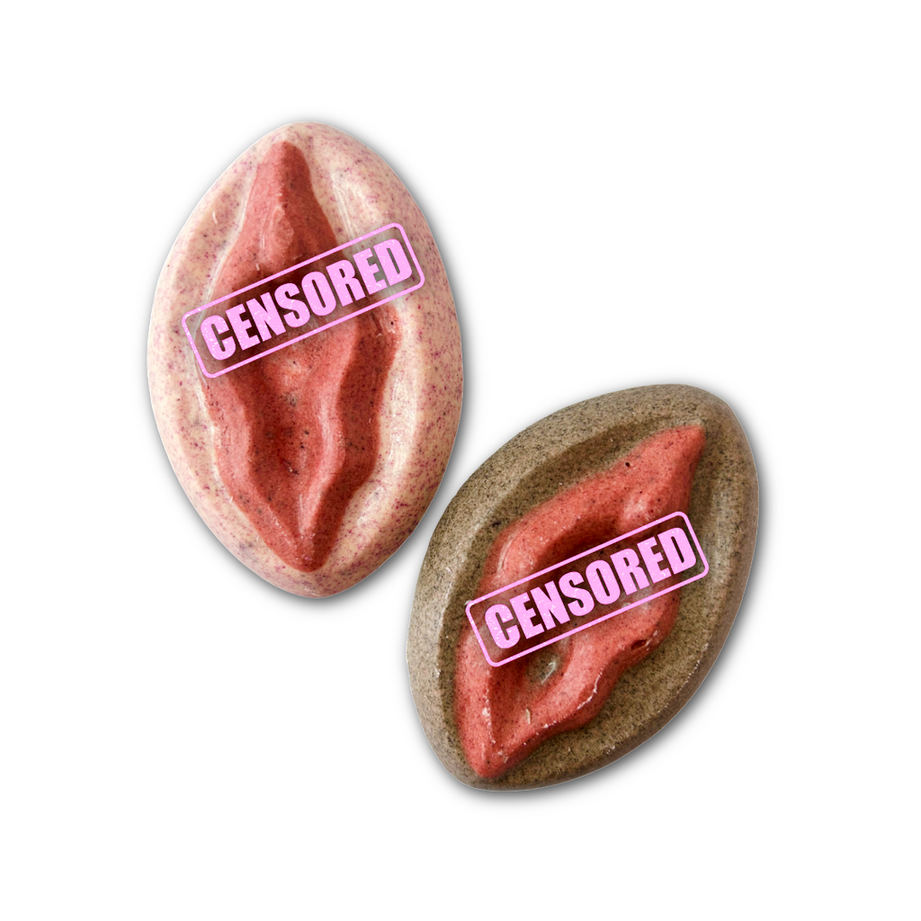 Two female flower chocolates, one pink with red in the middle, one brown with red in the middle. On a white background.