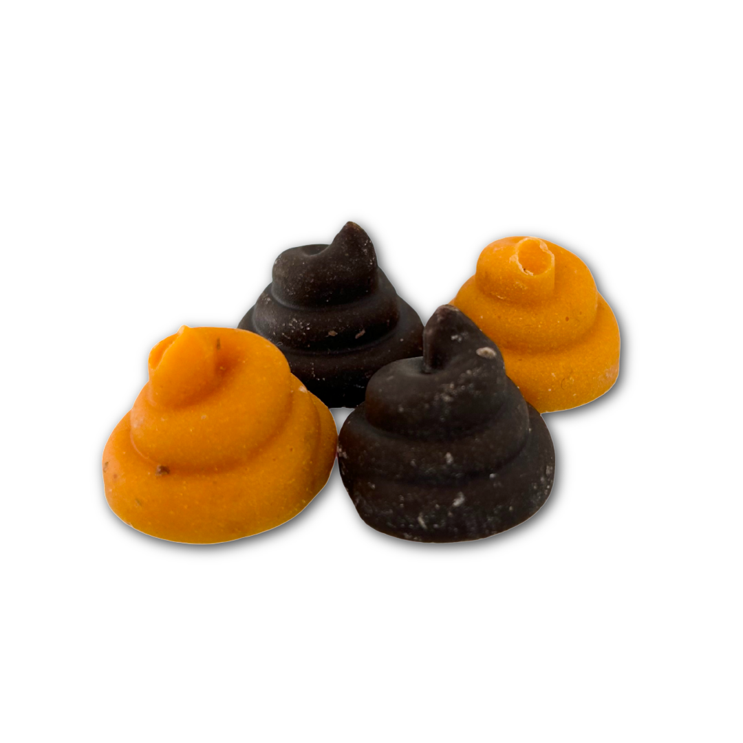 Four turd shaped chocolates - orange colour and brown colour, on a white background.