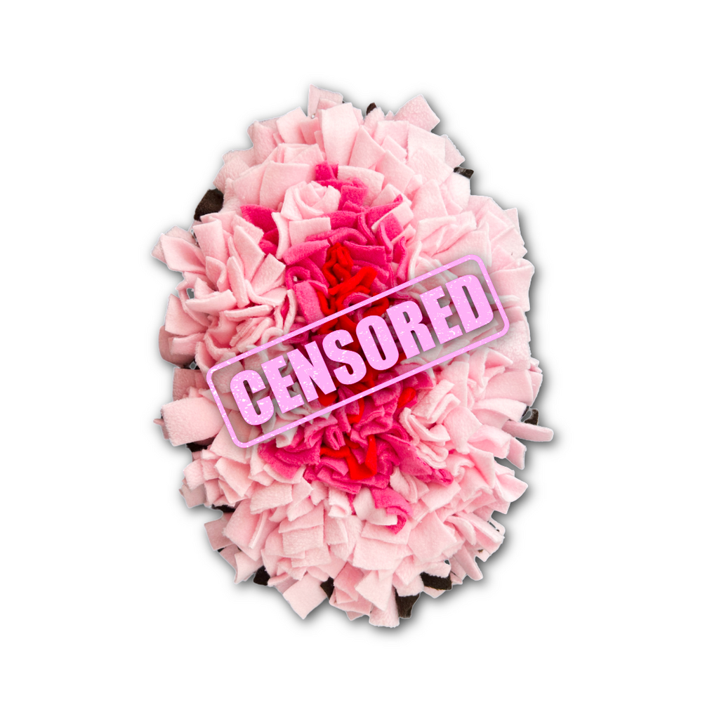 Pink and red snuffle mat in the shape of a cartoon female flower with fabric texture on a white background.