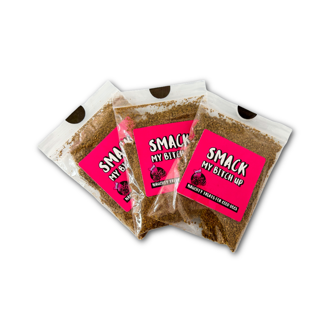 Three packages of brown powdered black pudding sausage in small clear bags, with 'Smack My Bitch Up' in white writing on a pink sticker. On a white background. 