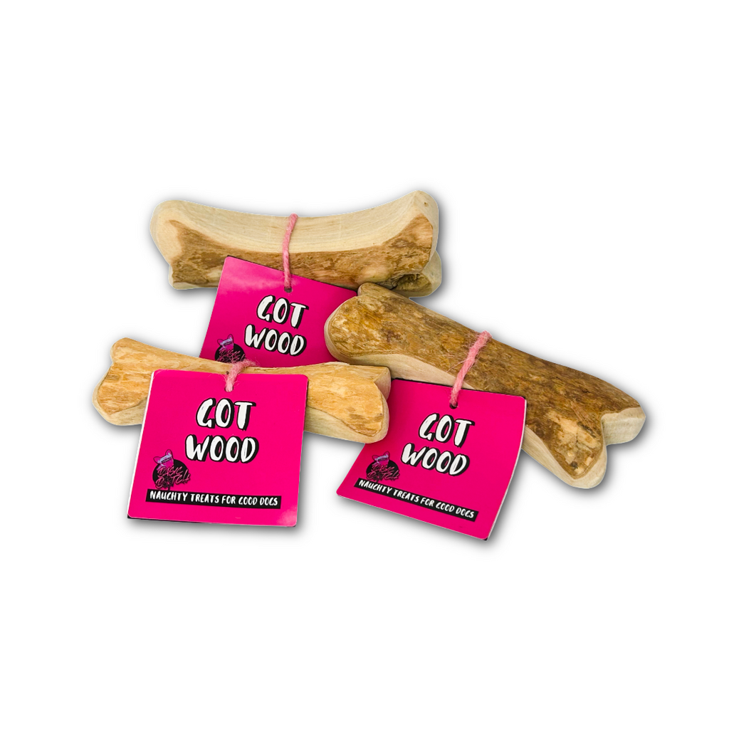 Three wooden bones in a pile, with pink tags on, and the words 'Got Wood' in white. On a white background.
