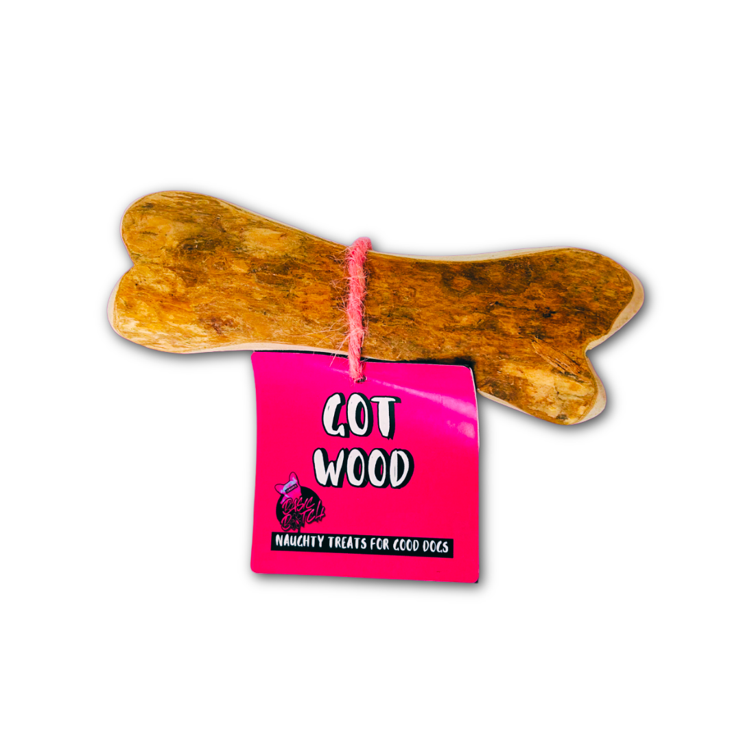 Wooden dog bone with a pink label reading 'Got Wood' on a white background.